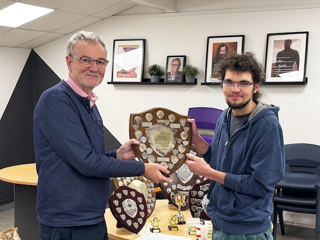 The Division 2 trophy was won by Newton Abbot. Joshua Blackmore received the trophy on behalf of Newton Abbot.