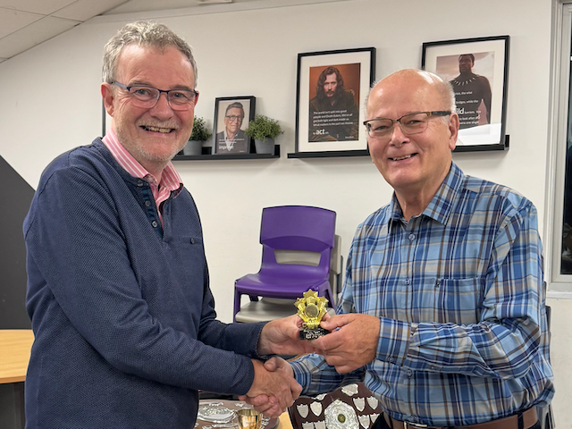 Normal roles restored. Paul Brooks presents the Division 3 Player of the Year trophy to Tony Tatam (Plymouth)